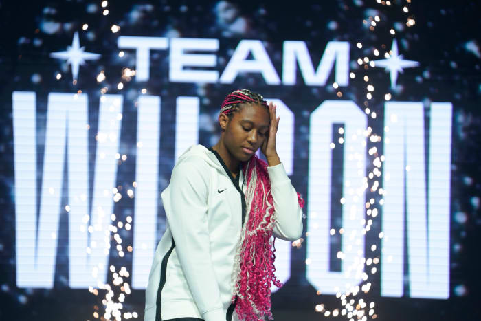 Aliyah Boston poses on stage during player introductions prior to the 2023 WNBA All-Star Game.